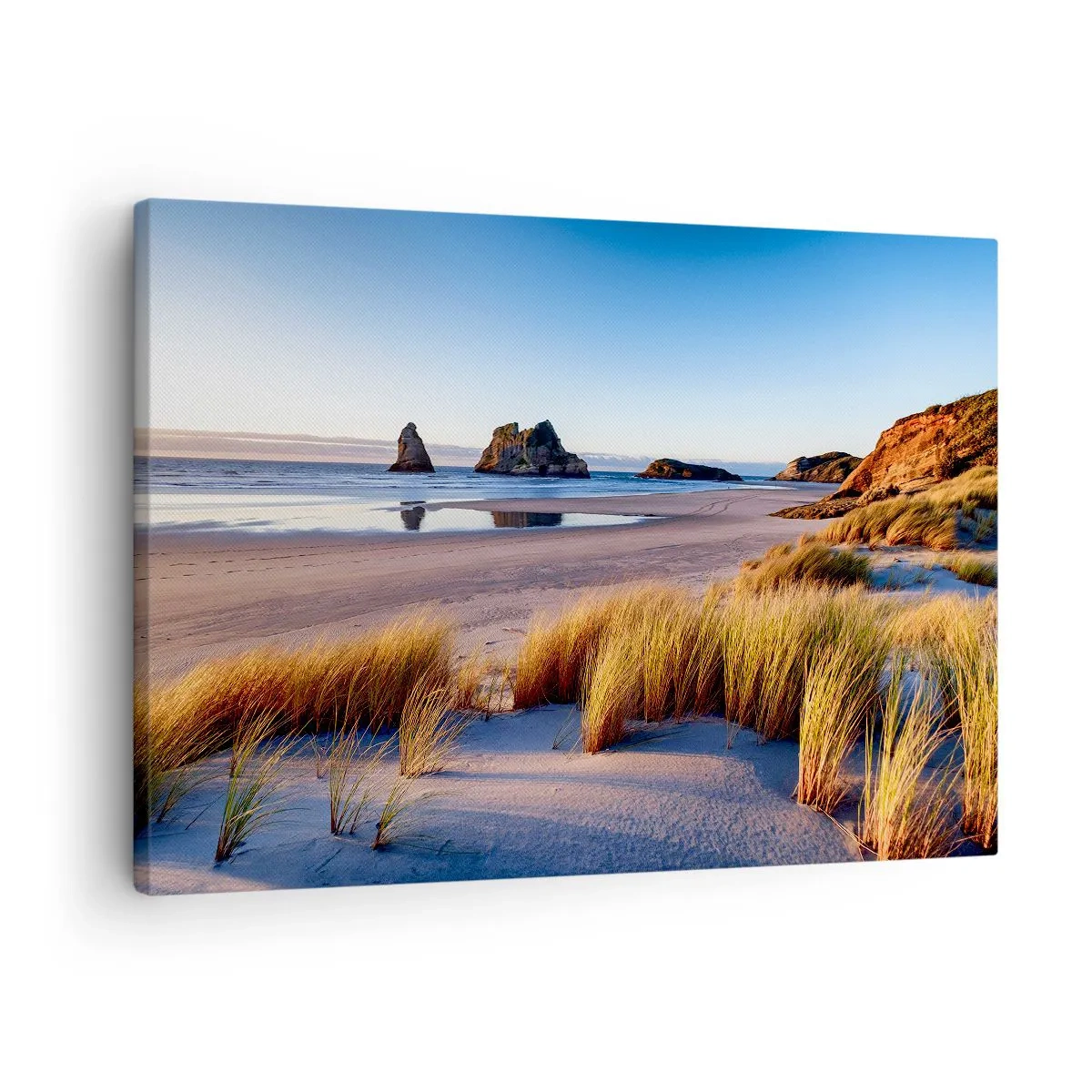 Canvastavla - Bild på duk - En pittoresk strand med utsikt över klipporna och havet vid solnedgången - 70x50cm - För fredssökare - Modern väggdekoration för vardagsrum och sovrum ARTTOR