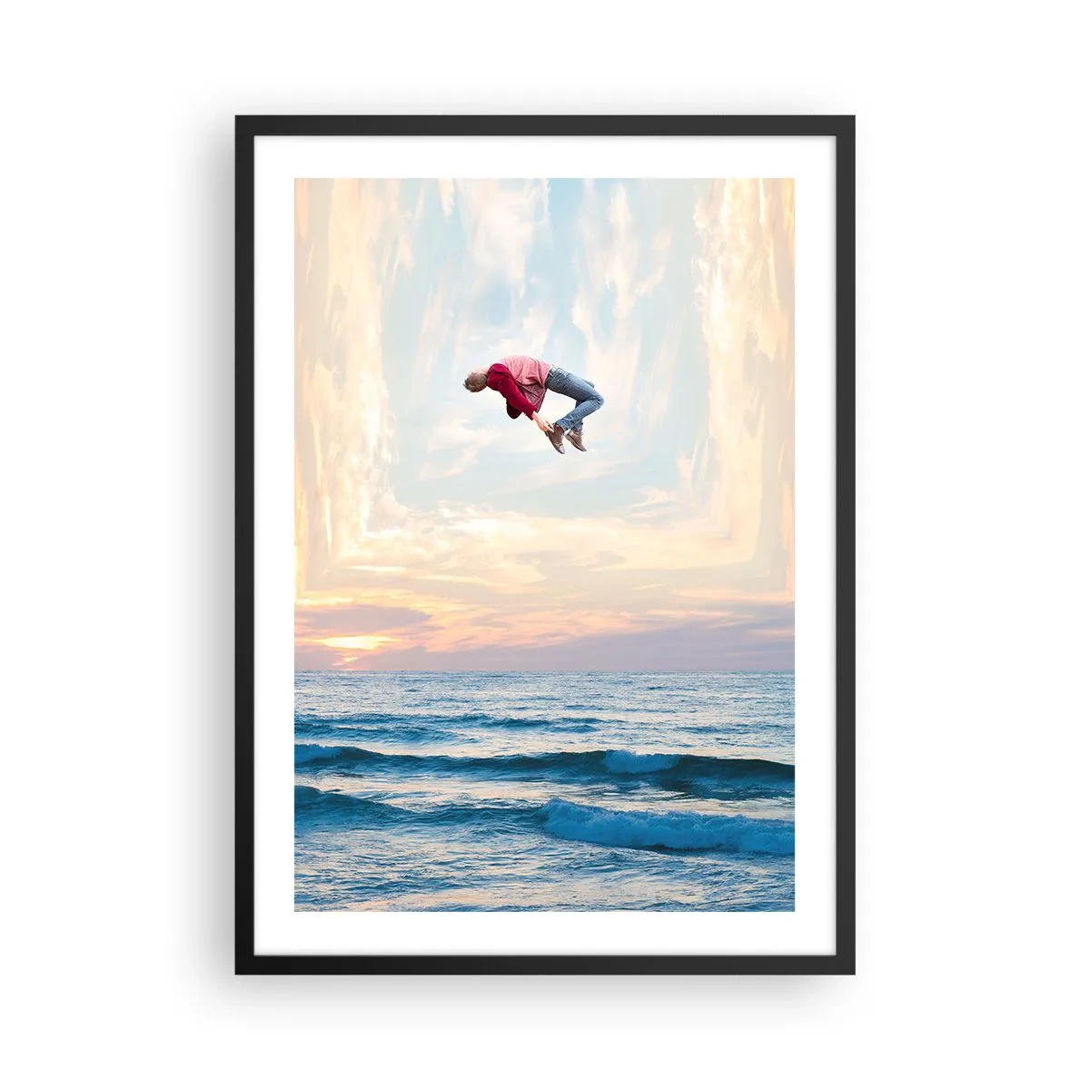 Affisch i svart ram - En man hoppar upp i himlen över havet vid solnedgången - 50x70cm - Till en annan dimension - Modern väggdekoration för vardagsrum och sovrum ARTTOR